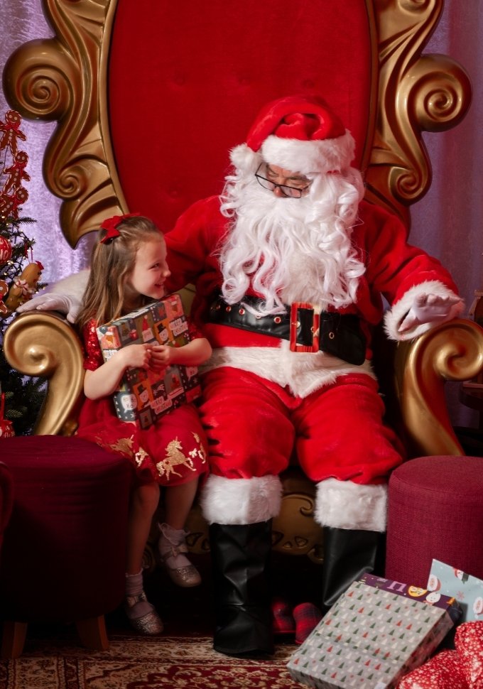Child meeting Santa during a Santa Sunday visit at Fratelli Belfast